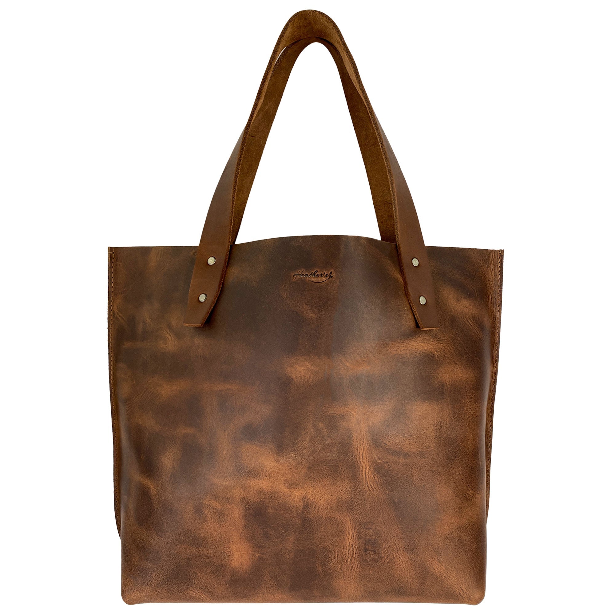 Heather's Minimalist Shoulder Bag in rich brown Full Grain Leather, showcasing a classic design for everyday use, travel, and shopping. This Minimalist Handbag Vintage Purse with Handle is durable and spacious, hand cut and hand sewn by artisans in La Antigua Guatemala.