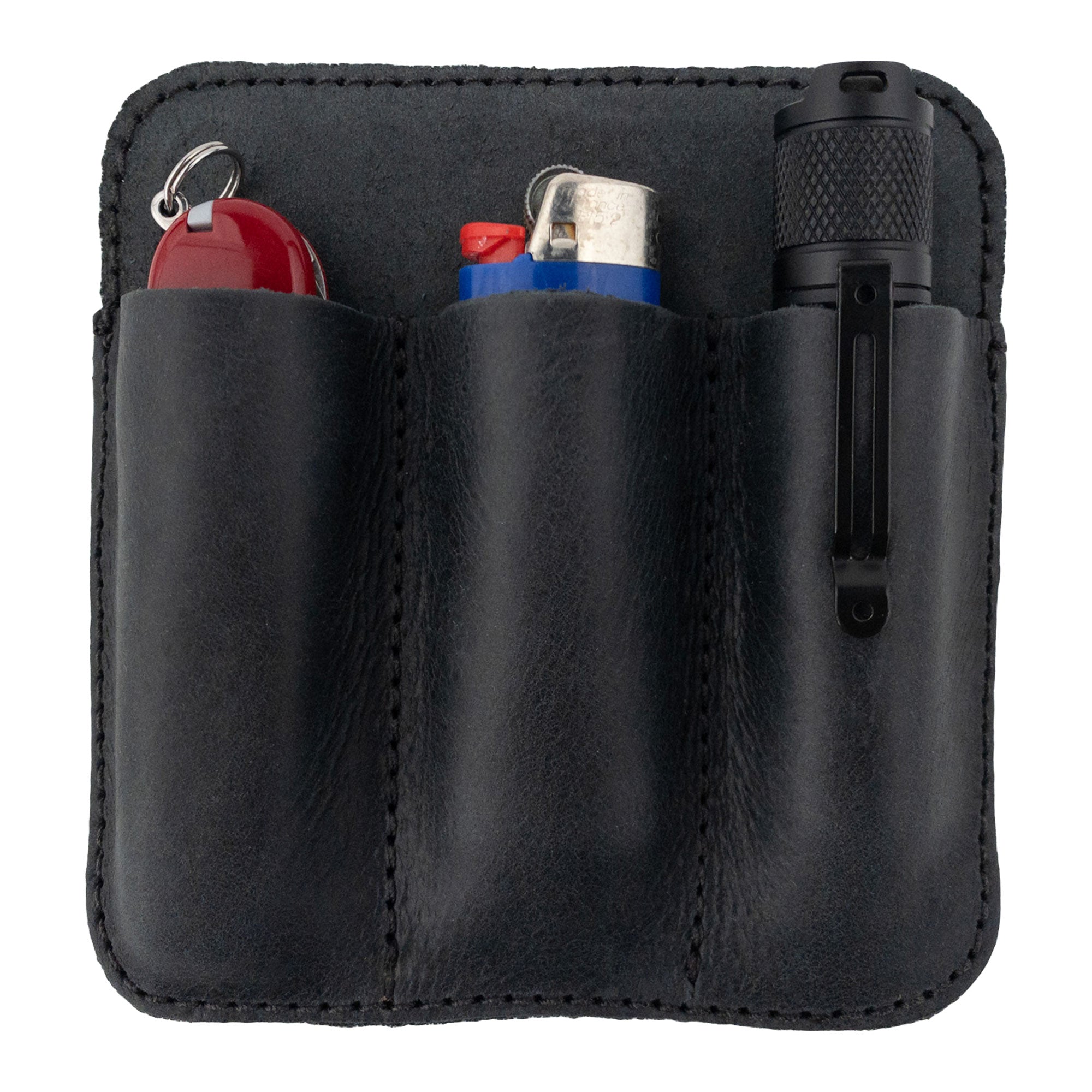 Hide & Drink Minimalist Tool Pocket filled with essential tools like lighters, emphasizing practicality. Made from Full Grain Leather, this Tool Pocket Pouch is carefully hand sewn and cut, ensuring unique artisan quality from La Antigua Guatemala with a focus on small batch production.
