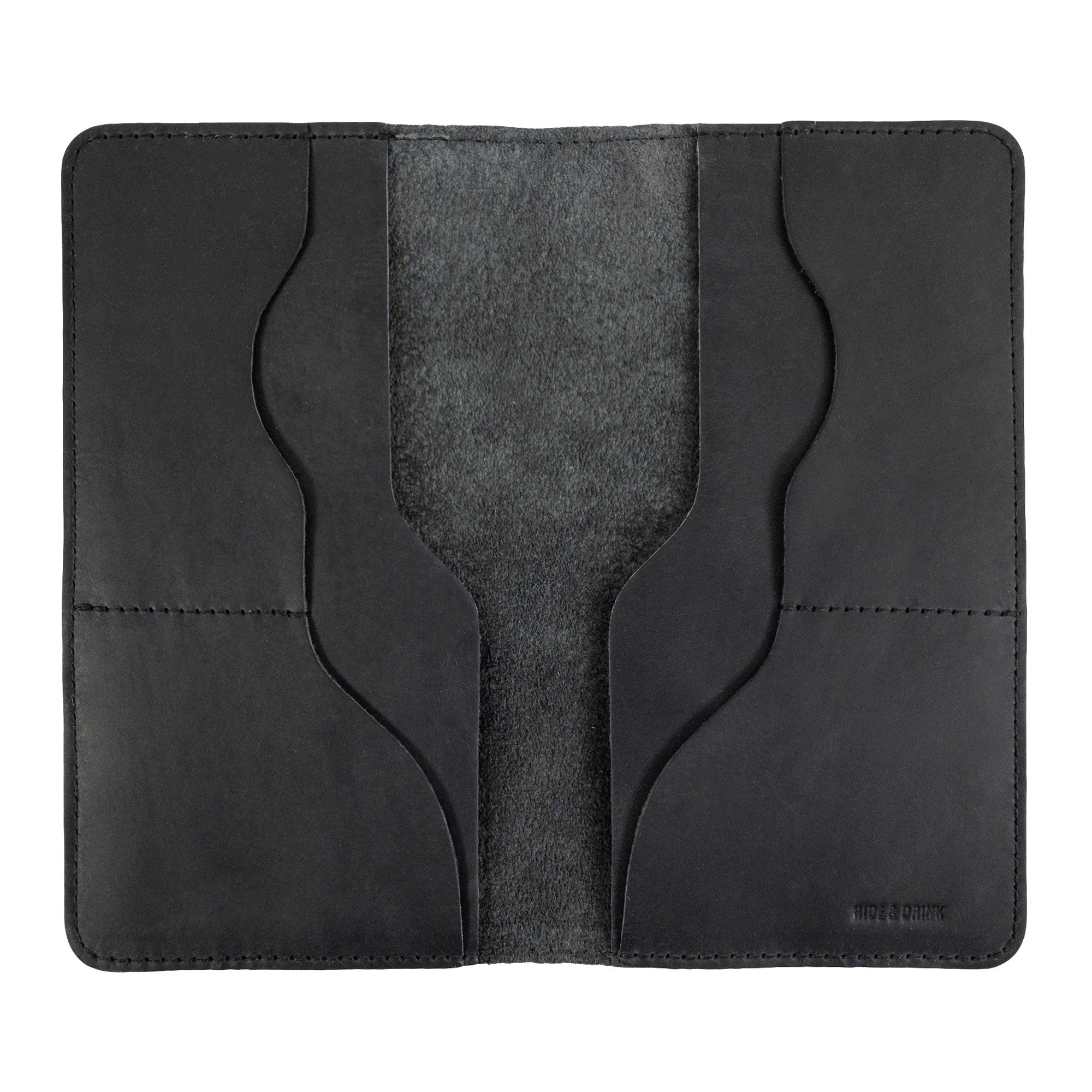 Hide & Drink Large Organizer Wallet closed and showcasing its durable design. This artisan-made bifold wallet provides card slots and a flat money holder, crafted from full grain leather in La Antigua Guatemala & Oaxaca Mexico.