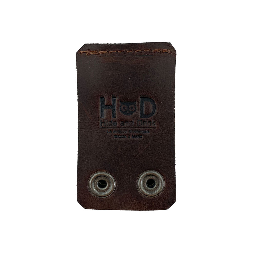 The back view of the Belt Keychain Holder Hook by Hide & Drink, showcasing the logo and the durable thick full grain leather, ideal for a belt clip key chain holder hook. This artisan piece is handmade in La Antigua Guatemala & Oaxaca Mexico, reflecting small batch production excellence.