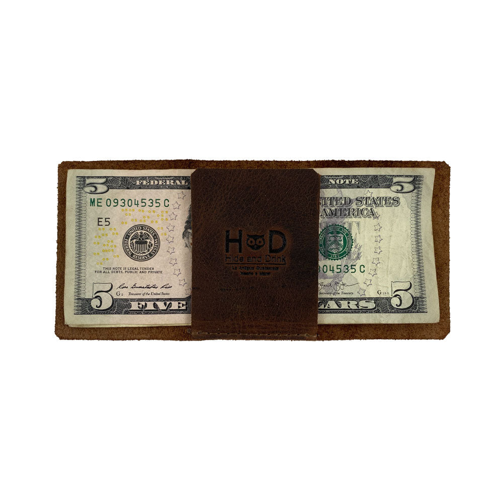 Featuring bills secured in the Hide & Drink Minimalist Wallet Bills Only, this cash organizer is made from premium Full Grain Leather. This Ultra Minimalist Wallet combines style with functionality, crafted by artisans in La Antigua Guatemala with a focus on small batch production and meticulous hand sewing.