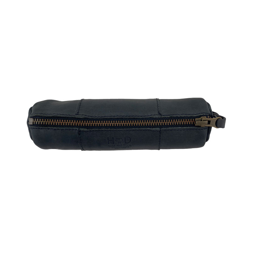 Side view of the Utility Cylinder Case by Hide & Drink highlighting its robust zipper, perfect for securing office supplies or personal items. This classic, handmade bag features Full Grain Leather craftsmanship. Cylinder Case, Handmade, Rustic.