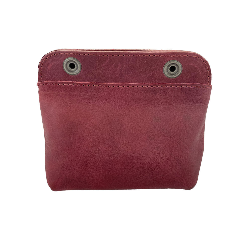 Back view of Hide & Drink Double Snap Pouch in eye-catching green leather, highlighting its practical design as a cash & card holder. Made by artisans from full grain leather in La Antigua Guatemala.