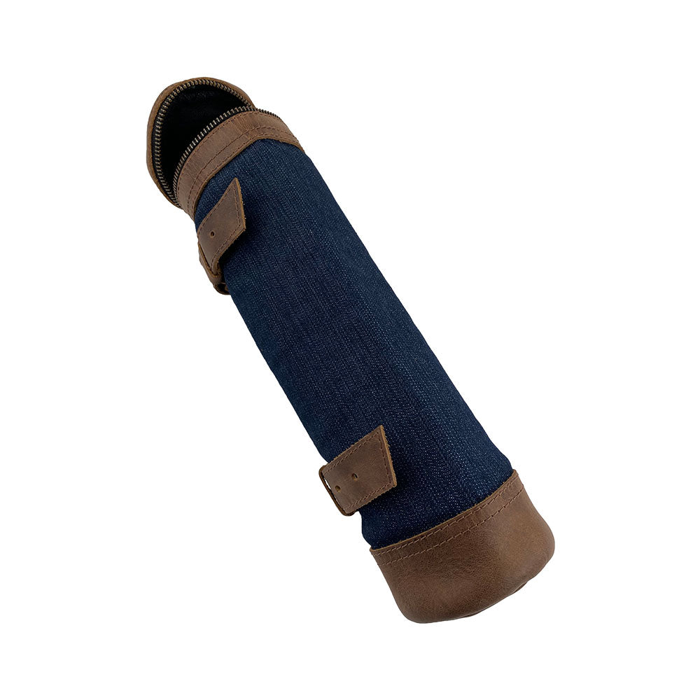 The Navy Blue Bicycle Tube from Hide & Drink, ready for use with a wine bottle nestled inside. This Drink and Travel Storage solution promotes small batch production and artisanal quality for biking adventures. Handmade in La Antigua Guatemala and Oaxaca Mexico.