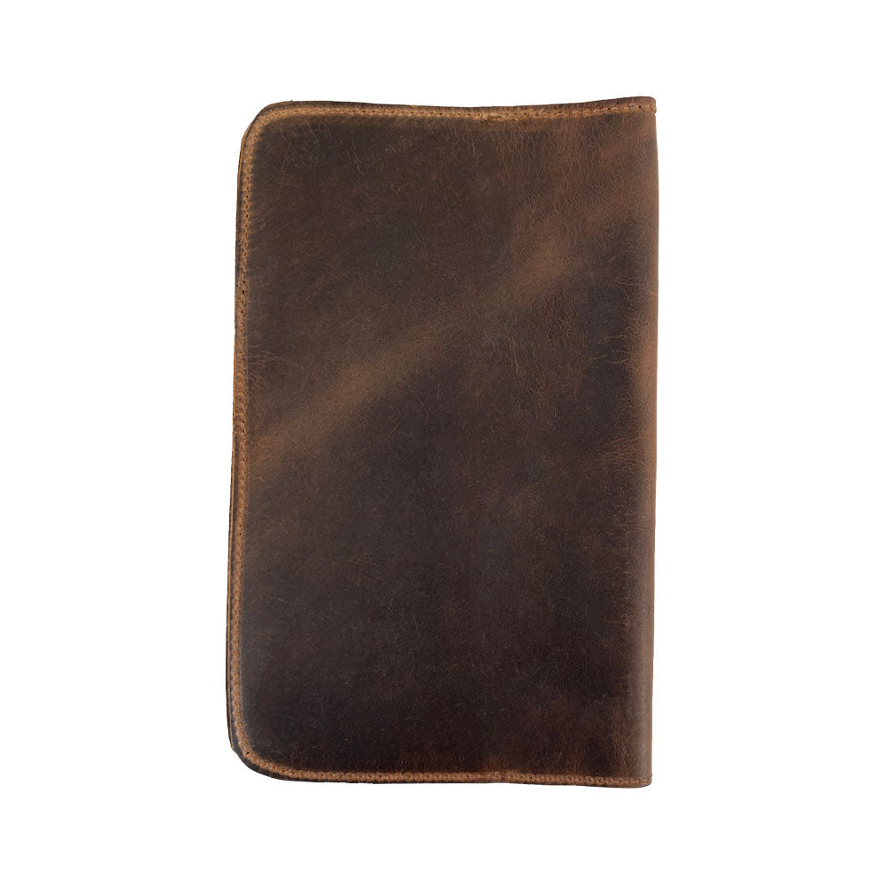 Back view of the Journal Cover for Moleskine Cahier L (5 x 8.25 in.) by Hide & Drink. This rustic protector for your large size (5 x 8.25 in.) notebook is made from durable full grain leather, featuring exquisite handcrafted details by artisan hands.