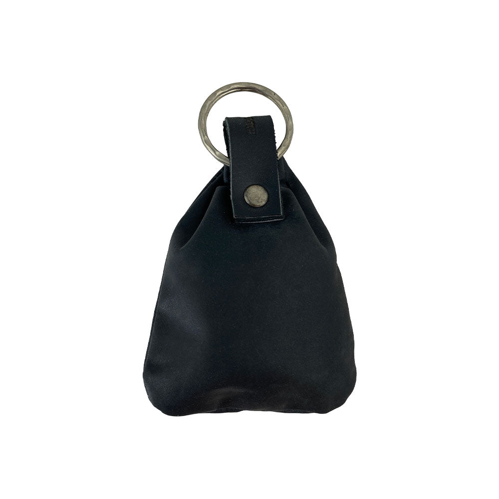 A side view of the Mini Medieval Pouch Keychain by Hide & Drink, showcasing its luxurious black leather. This tiny bag with keyring acts as a mini coin pouch while representing high-quality artisan craftsmanship from La Antigua Guatemala.