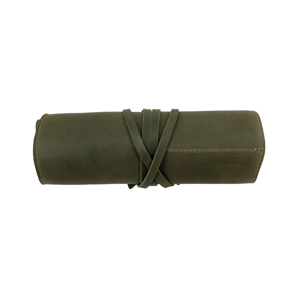 Detailed view of the Hide & Drink Multi Purpose Pencil Roll showing its impressive leather finish and storage capabilities. Hand cut and sewn, this rustic pouch is perfect for scissors and earphones, celebrating small batch production values.