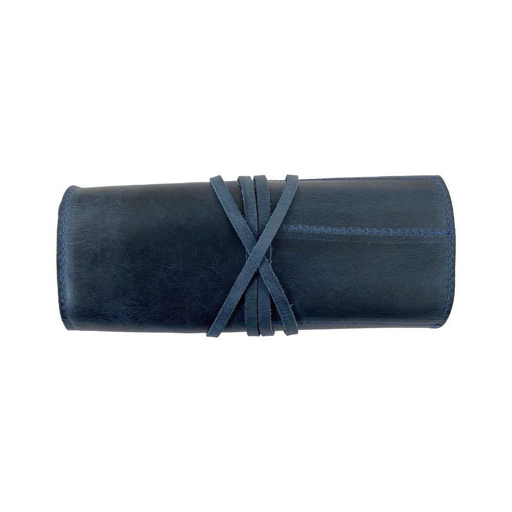 Hide & Drink Multi Purpose Pencil Roll in its natural closed form, highlighting the sturdy leather and practical design ideal for storing essential tools. An artisan-made rustic pouch perfect for craft and work organization.