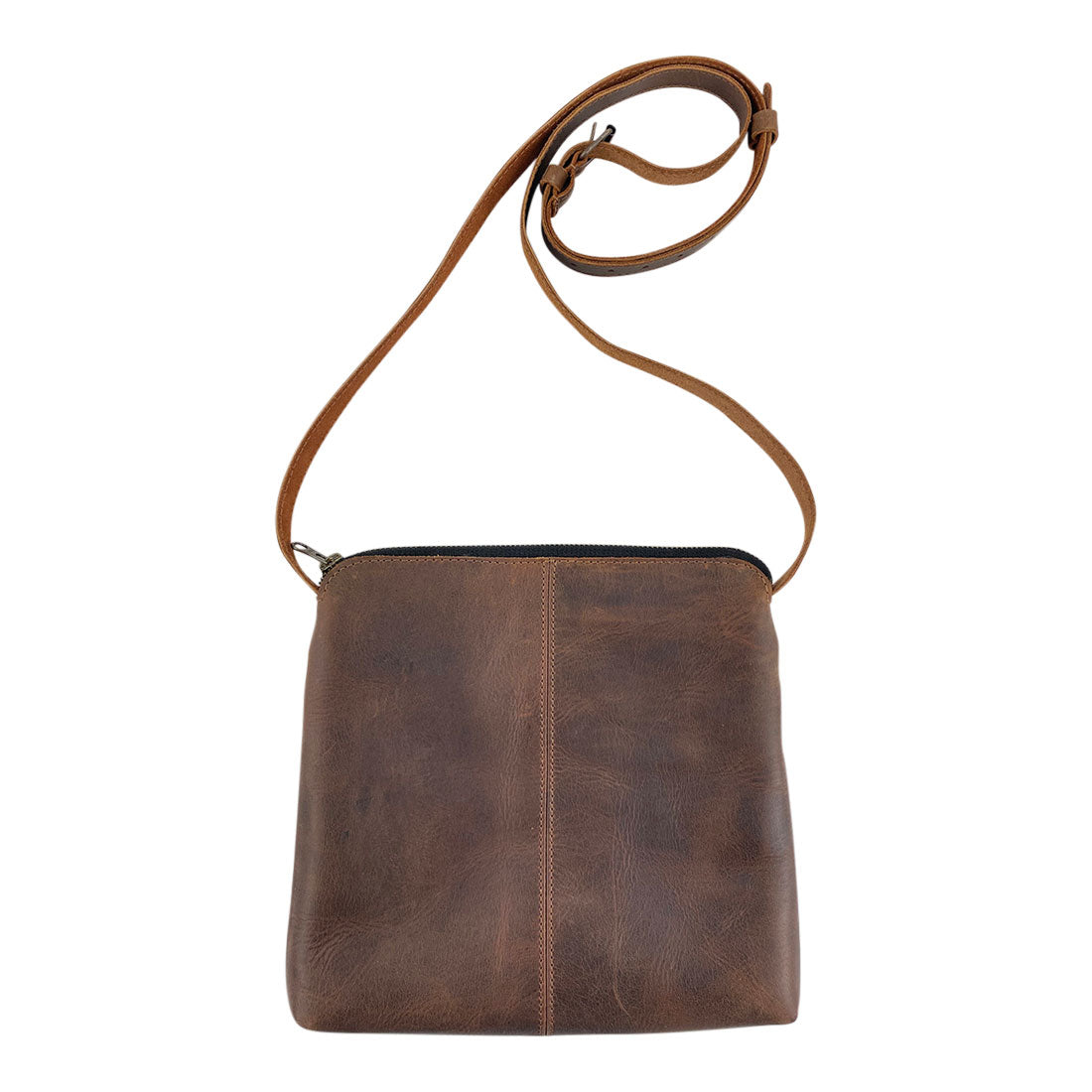 Back view of the 3 Zipper Satchel by Hide & Drink, highlighting its sleek design and quality craftsmanship with rustic leather. This practical purse is ideal for travel or daily carry. 3 Zipper Satchel - Versatile Handbag, Handmade from Full Grain Leather and Plaid Cotton, Small Batch Production, Hand Cut, Hand Sewn, Fire Branded, Artisan, Handmade in La Antigua Guatemala & Oaxaca Mexico.