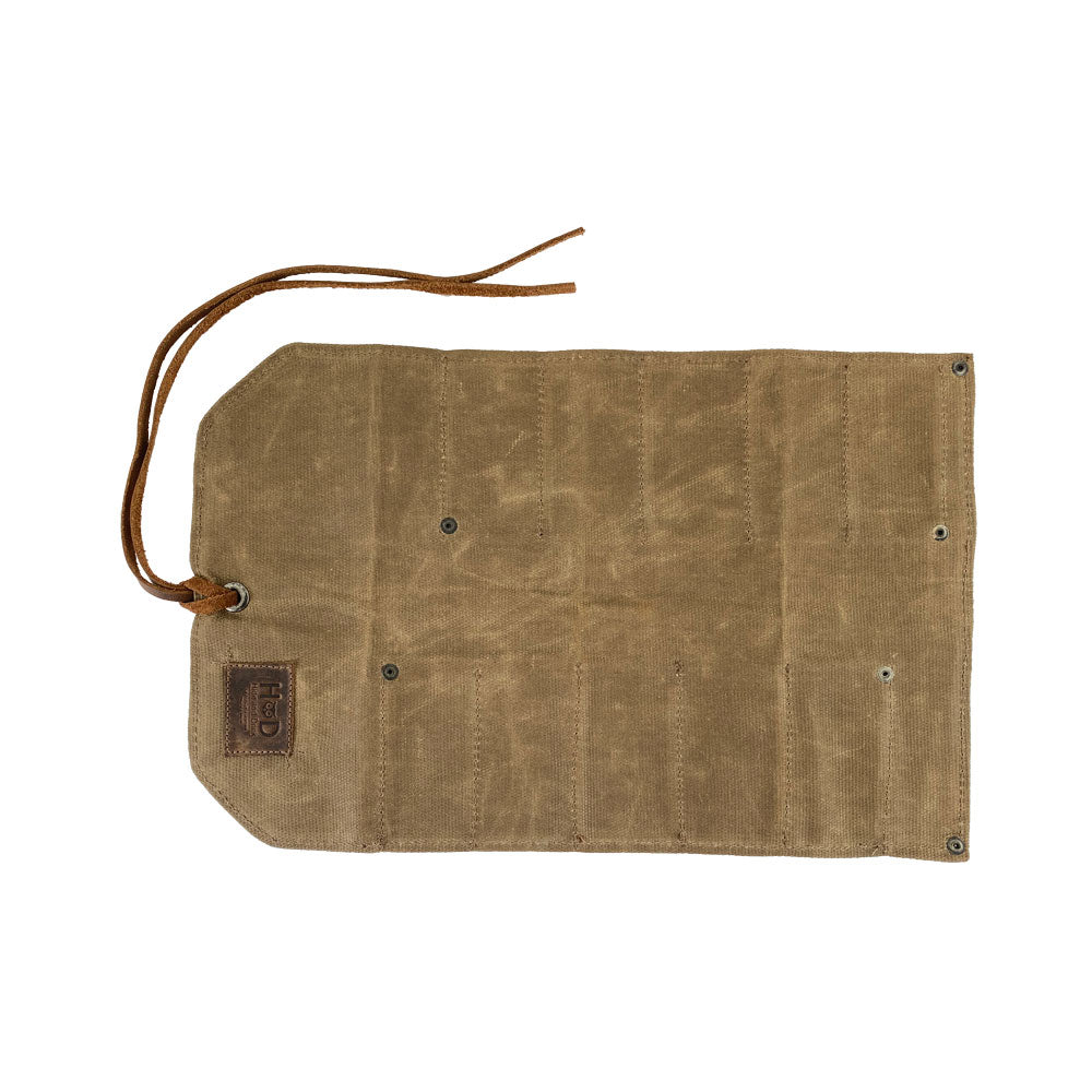 Hide & Drink Tool Roll presents a classic small tool roll-up bag with 10 slots, made from robust full grain leather. This portable carry-on pouch is great for organizing woodworking tools, fitting seamlessly into your workshop storage needs. Each artisan product is hand sewn and crafted in La Antigua Guatemala & Oaxaca Mexico.