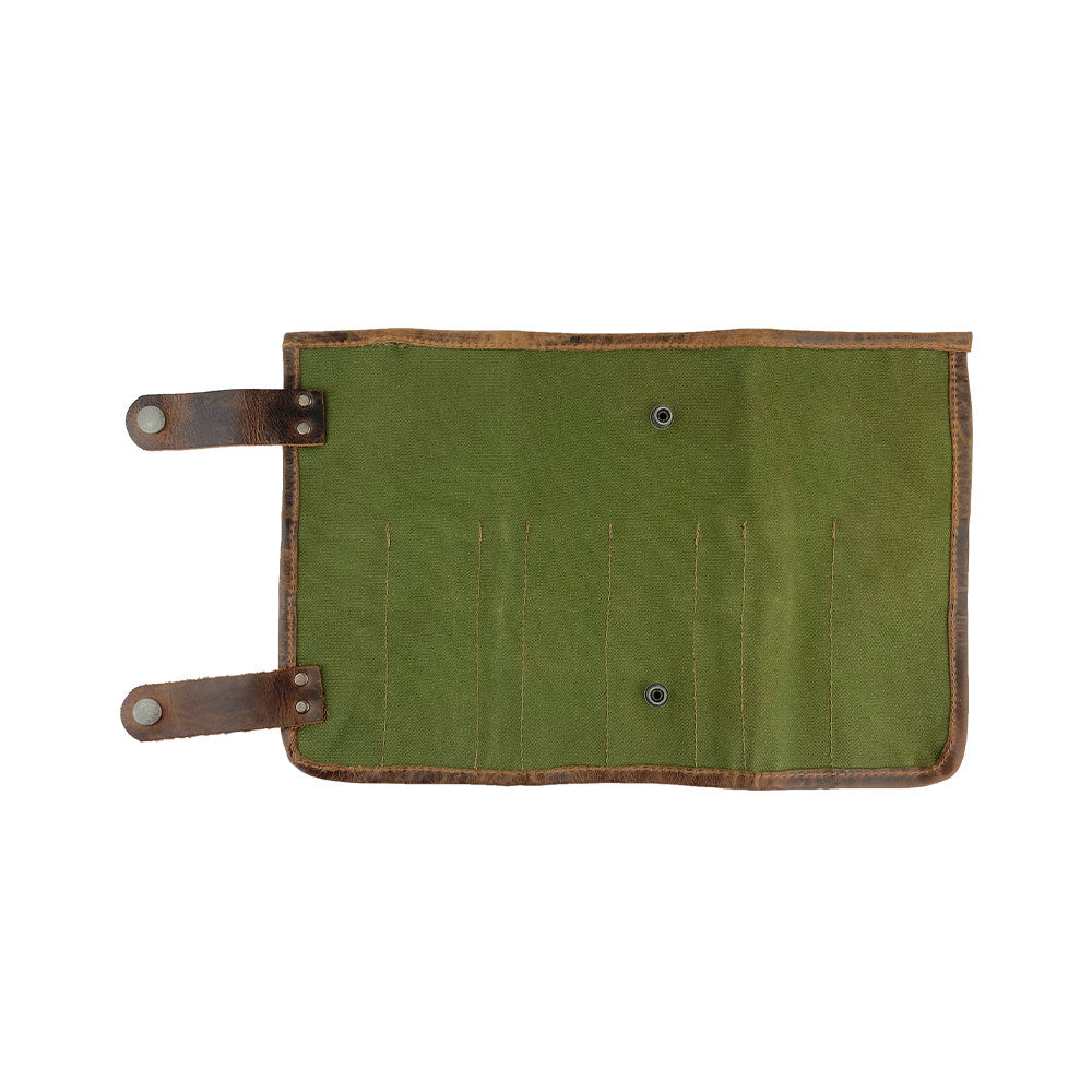Hide & Drink's Barber Tool Roll features a Snap Tool Roll Up Bag with 14 Slots for scissors & screwdrivers, crafted from Full Grain Leather. This portable carry case emphasizes StockyardX's commitment to small batch production, artisan craftsmanship, hand cut, hand sewn, and fire branded in La Antigua Guatemala & Oaxaca Mexico.