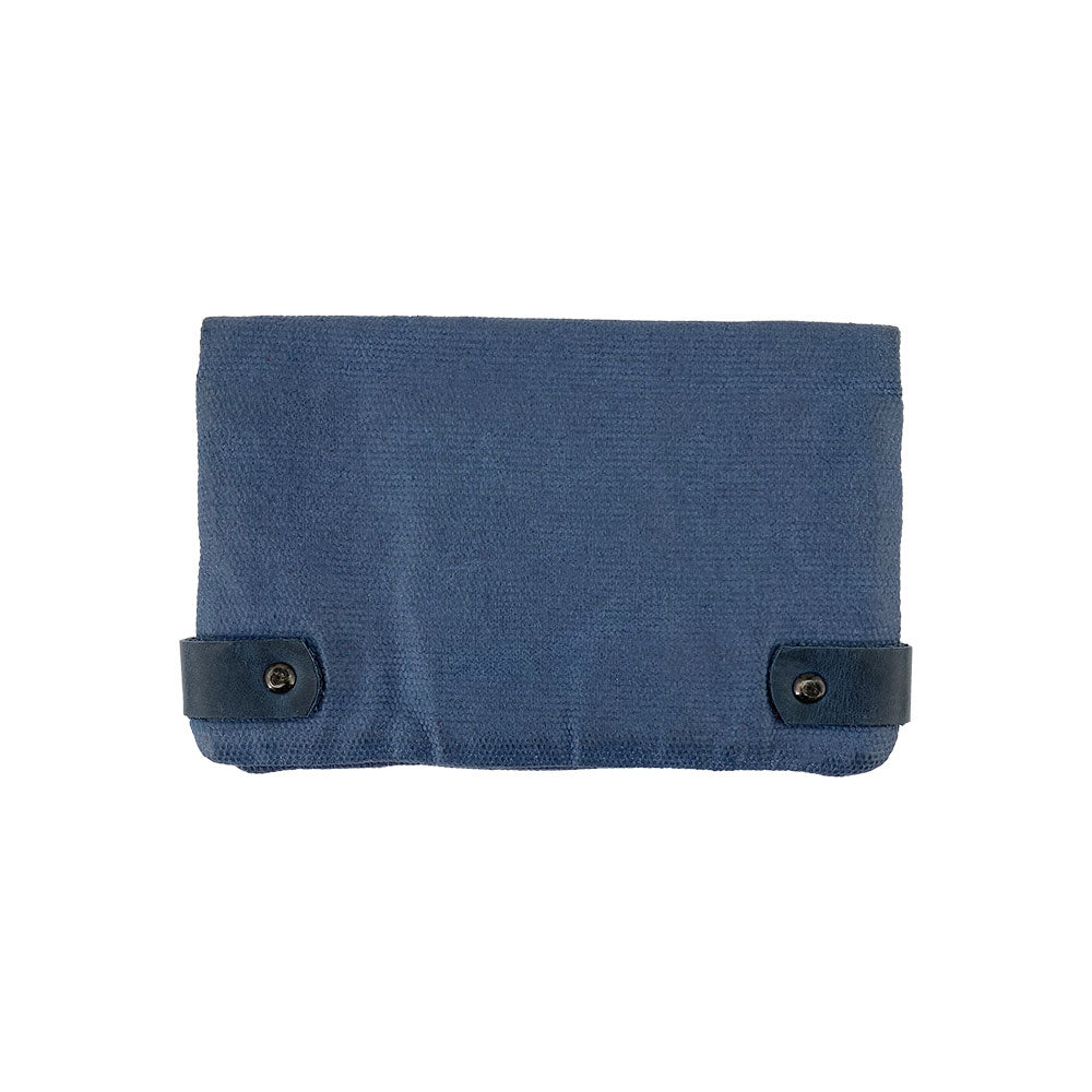 Back view of the blue Hide & Drink Tobacco Pouch Waxed Canvas showcasing its minimalistic design. Ideal for tobacco enthusiasts, this handmade artisan pouch reflects dedication to quality and classic storage solutions.