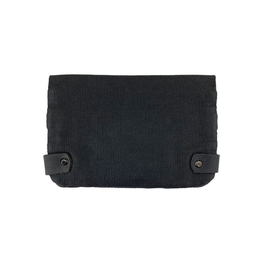 Back view of the black Hide & Drink Tobacco Pouch Waxed Canvas. This travel essential features an artisan-crafted design ideal for storing tobacco and organizing notes, showcasing durable and stylish quality.