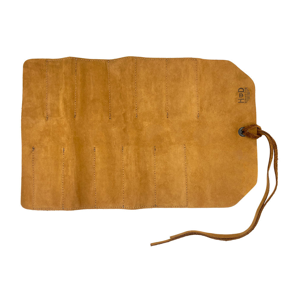 Hide & Drink Tool Roll showcases a stylish small tool roll-up bag with 10 slots, constructed from robust full grain leather. A perfect portable carry-on pouch for woodworking tools, blending beautifully into your workshop storage solution. Handmade with exceptional care in La Antigua Guatemala & Oaxaca Mexico, ensuring artisan excellence.
