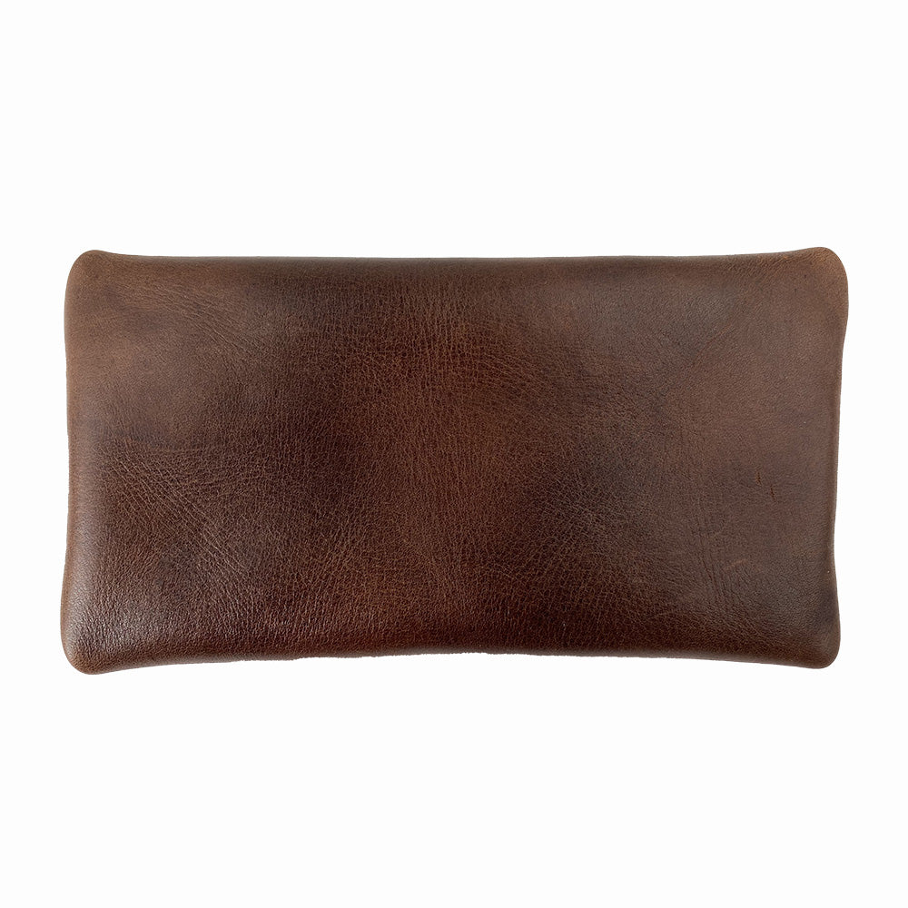 Hide & Drink Utility Cord Pouch displaying its full grain leather finish, suitable for everyday use. This stylish utility & charger case for MacBook, iPad & Laptop functions effectively as a cable organizer, highlighting its artisan-made quality from La Antigua Guatemala & Oaxaca Mexico.