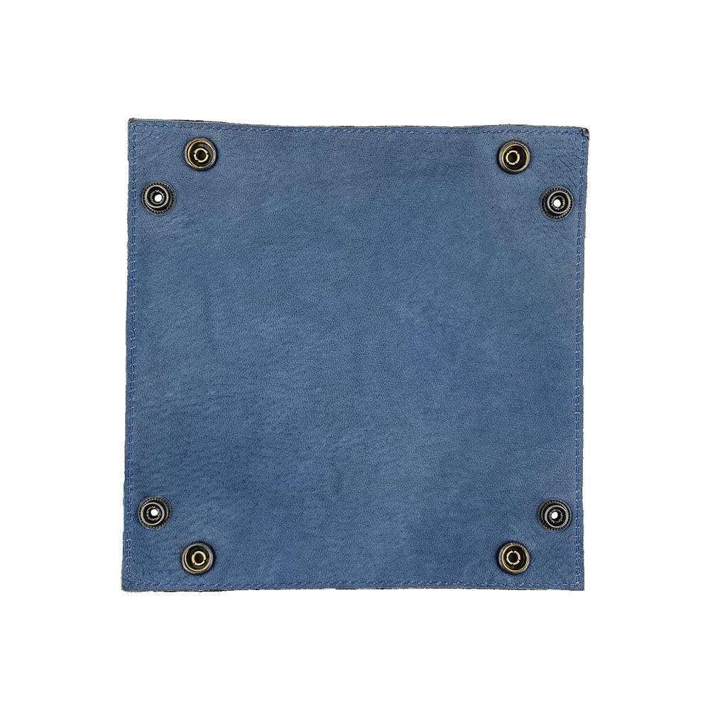 Detailed view of the blue Valet Tray with Sheep Skin from Hide & Drink, highlighting its sturdy brass hardware. This hand-sewn tray is great for organizing keys and coins, combining functionality with artisan craftsmanship made in La Antigua Guatemala & Oaxaca Mexico, ensuring each piece is unique.