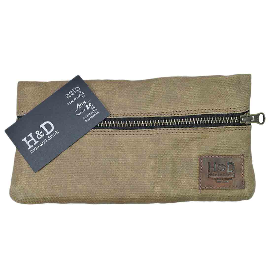 Spotless design of the Hide & Drink Vape Pen Case (Accessories not included) with informative branding card showcases its artisanal roots. Perfect Pen Accessories Kit Pouch Holder for secure fit and stylish travel. G Pen Soft Travel Bag Handmade from Waxed Canvas, Full Grain Leather, StockyardX, Small Batch Production, Hand Cut, Hand Sewn, Fire Branded, Artisan, Handmade in La Antigua Guatemala & Oaxaca Mexico.