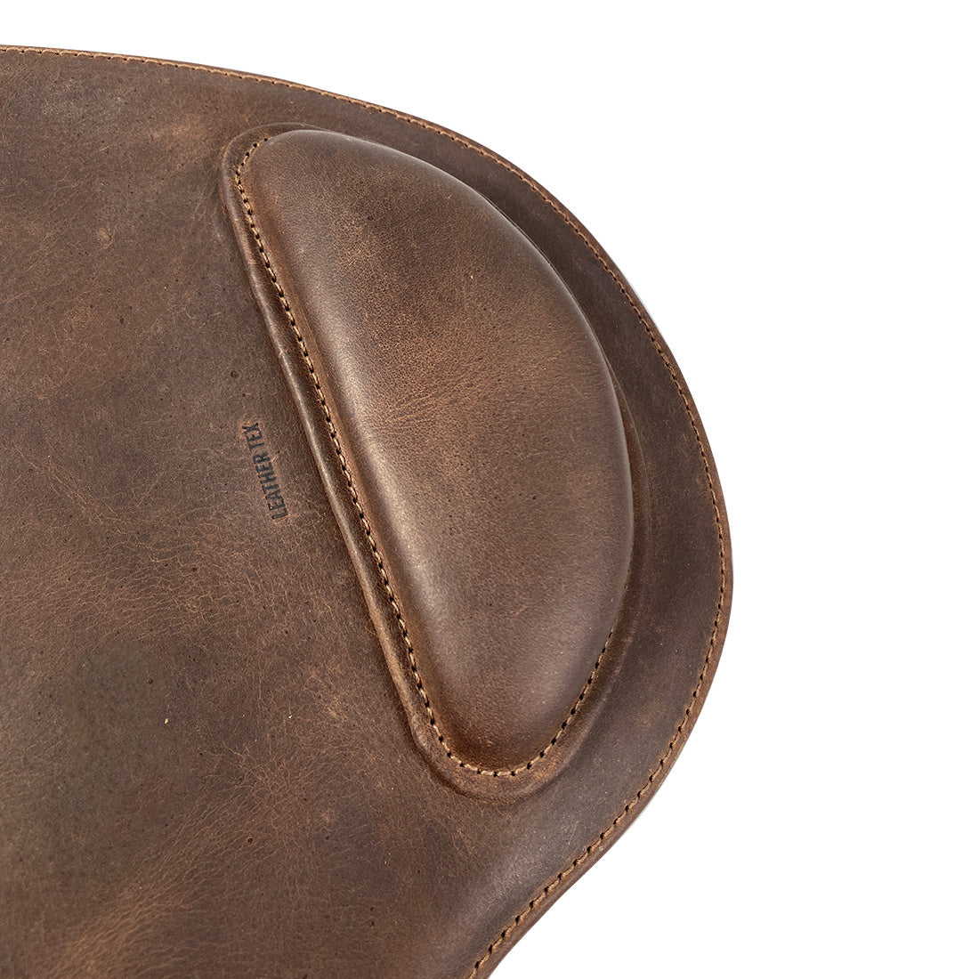 Close-up detail of the Rustic Oval Shape Mousepad by LeatherTex, highlighting the fine stitching and elegant design. This full grain leather mousepad with an anti-slip feature is a stylish accessory for computer and laptop users, perfect for office use. Handmade with care in La Antigua Guatemala & Oaxaca Mexico.
