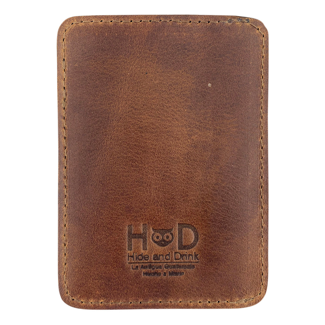 Back view of the AirTag Vertical Card Holder from Hide & Drink, highlighting the rustic charm of Full Grain Leather. This artisan product is handmade in La Antigua Guatemala & Oaxaca Mexico, reflecting small batch production, and impeccable attention to detail through hand cut and hand sewn techniques.