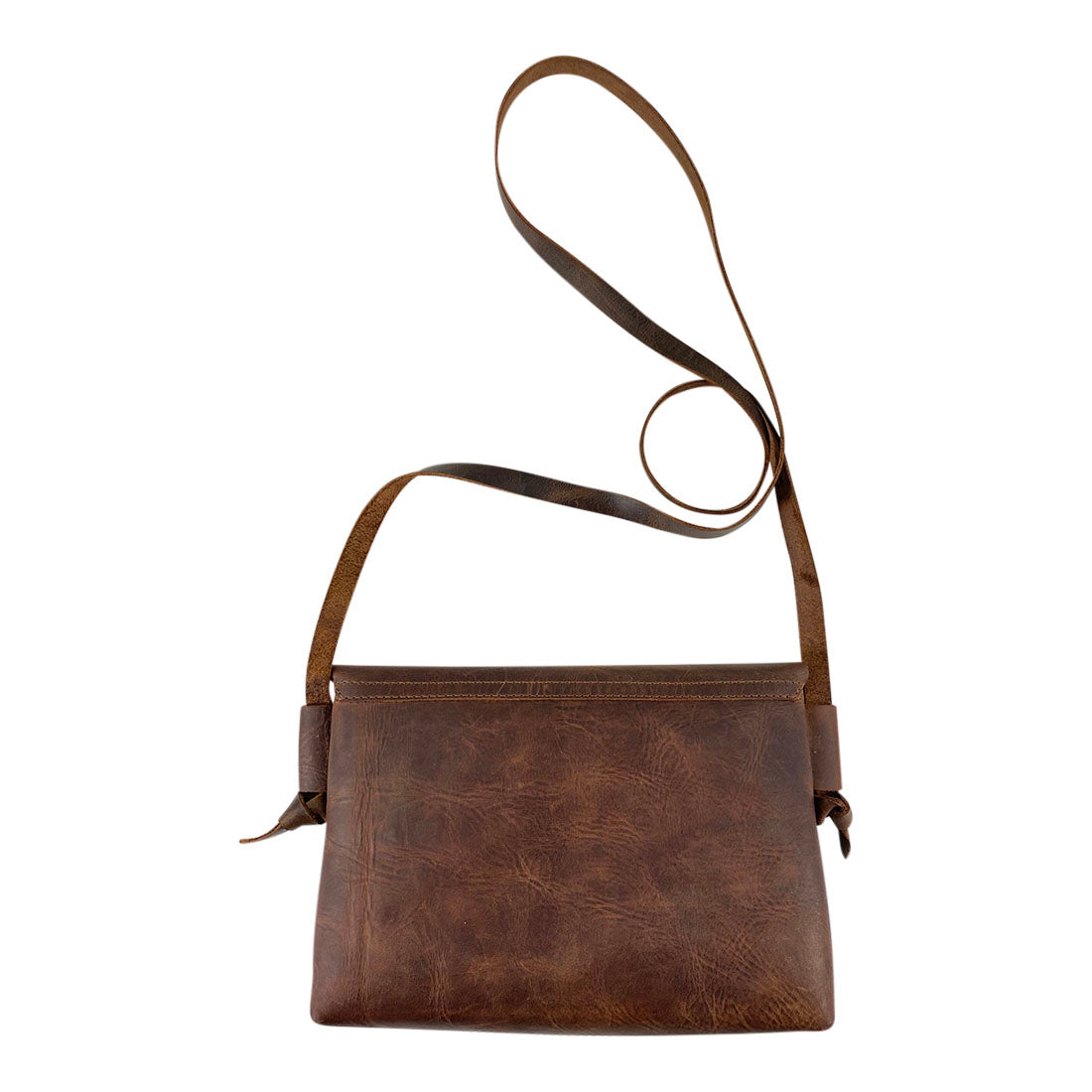 Beautifully crafted Horizontal Shoulder Bag from Hide & Drink, showcasing its durable Full Grain Leather. This Handmade piece is part of small batch production, expertly hand cut and hand sewn by artisans in La Antigua Guatemala & Oaxaca Mexico.