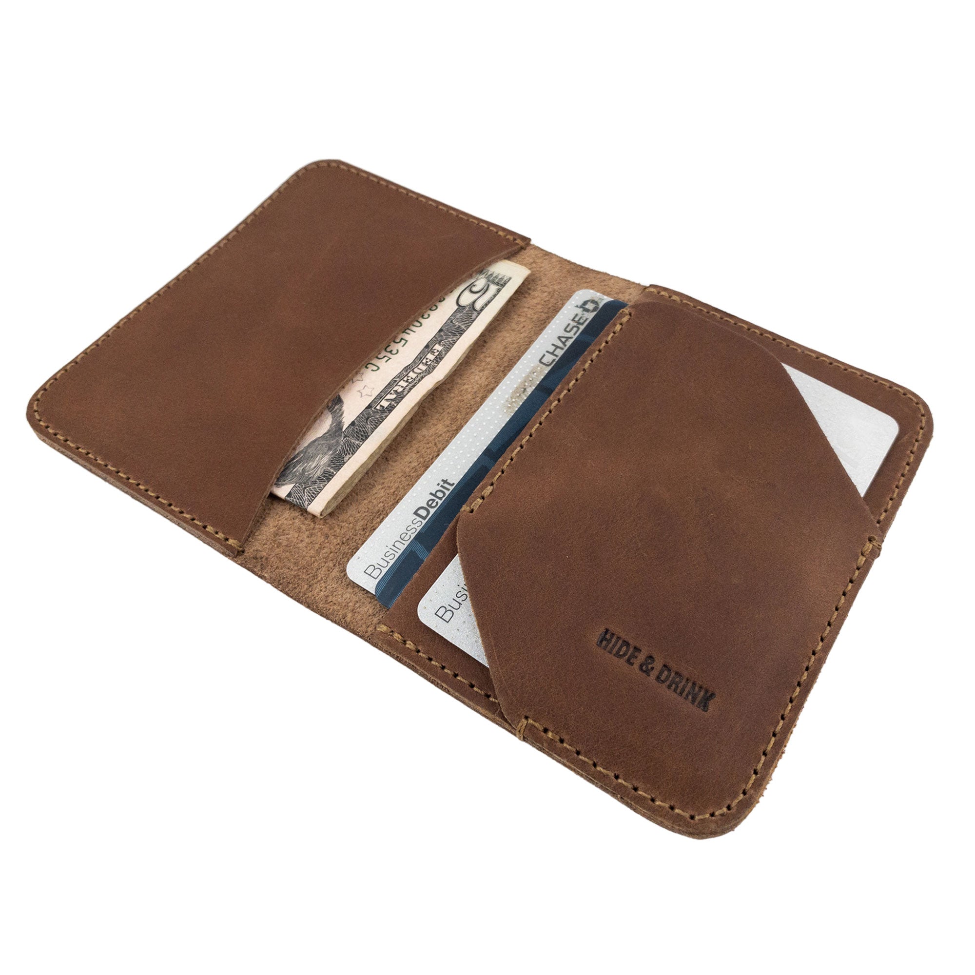 Brown Bi-Fold Card Wallet Diagonal by Hide & Drink, emphasizing its ability to hold several cards and cash securely; a perfect accessory crafted from full grain leather.