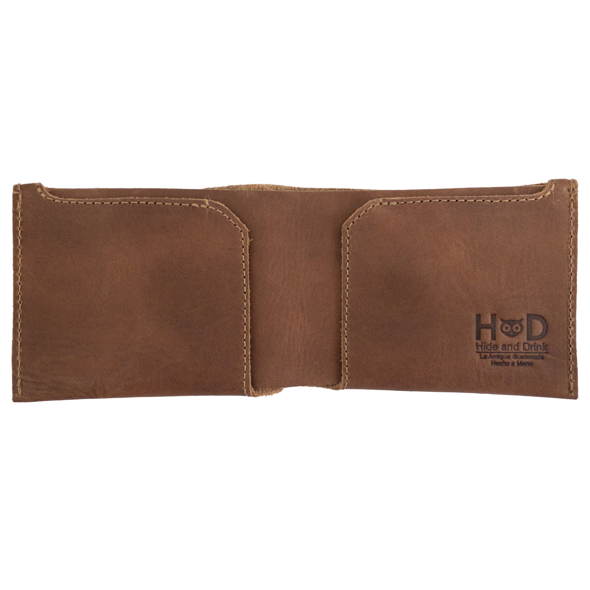 Close-up of the brown Hide & Drink Classic Wallet highlighting its quality materials and hand-stitched finish for a vintage look. Classic Wallet, Card Organizer, Money Holder, Vintage Pocket, Travel Accessories, Full Grain Leather, StockyardX, Small Batch Production, Hand Cut, Hand Sewn, Fire Branded, Artisan, Handmade in La Antigua Guatemala & Oaxaca Mexico.