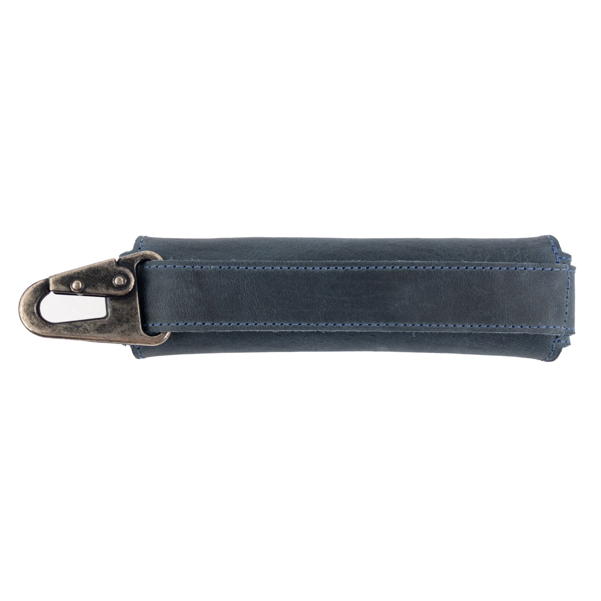 Side view of the blue Harmonica Case from Hide & Drink, showing its robust clasp and quality materials. This full grain leather instrument cover is perfect for musicians seeking style and durability, handcrafted in La Antigua Guatemala.