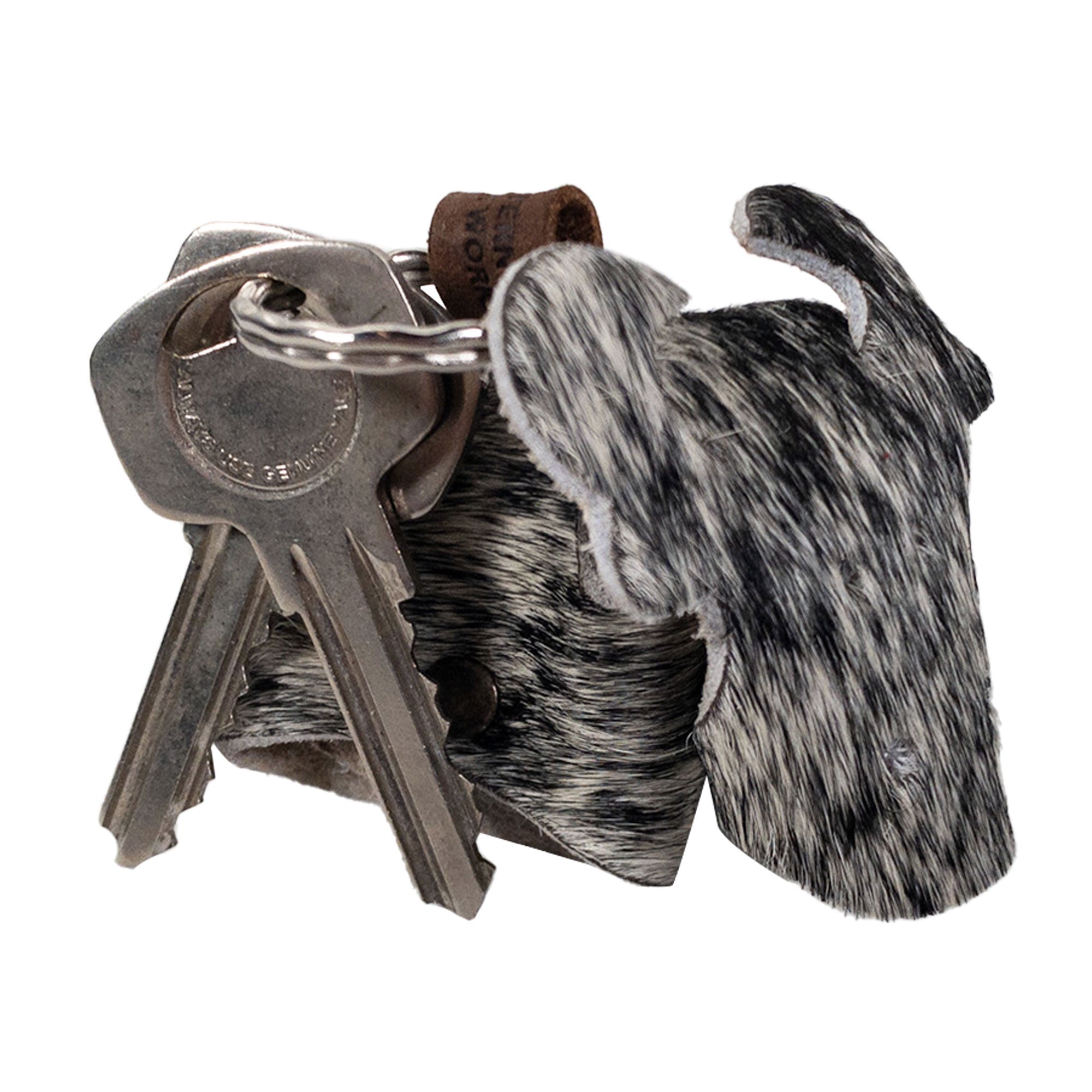 Stylish Cow Shape Keychain by Western Leather Works, featuring a functional design with keys attached. Crafted from durable Hair-On-Hide Full Grain Leather, this piece epitomizes small batch production with hand cut and hand sewn details, making it a splendid artisan accessory from La Antigua Guatemala and Oaxaca Mexico.
