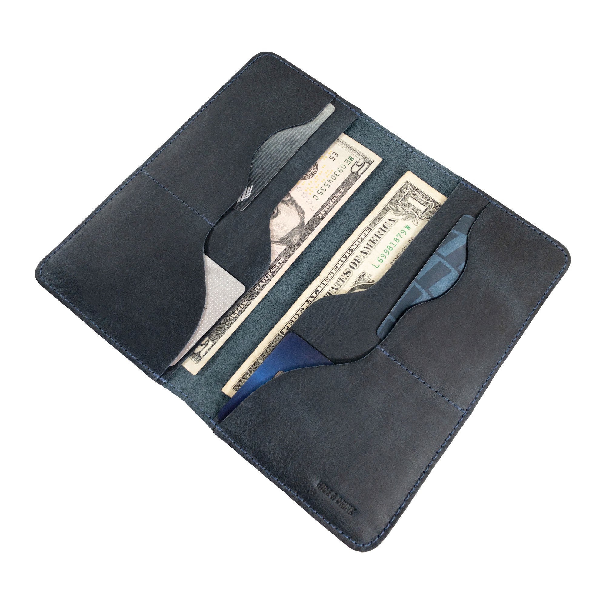 Hide & Drink Large Organizer Wallet showcasing the craftsmanship of small batch production and full grain leather. This handmade bifold wallet, with slots for cards and a flat money holder, is an essential travel accessory crafted in La Antigua Guatemala & Oaxaca Mexico.