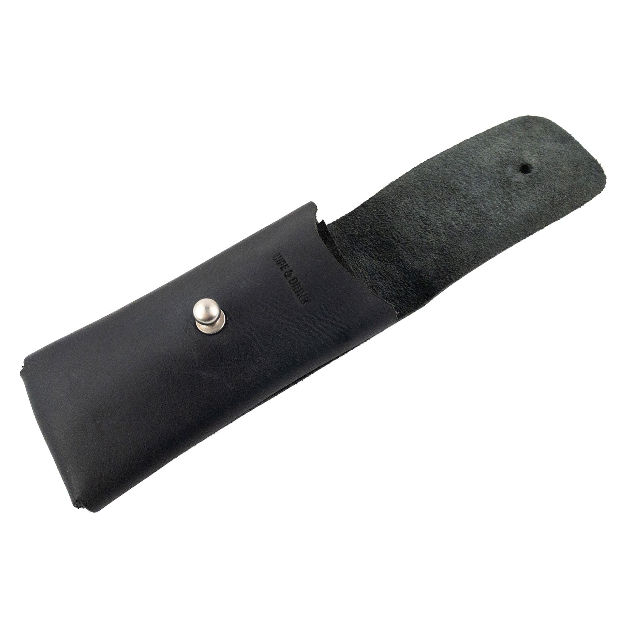 Hide & Drink Knife Case displayed open, showing the interior in black full grain leather. This riveted Swiss knife case is a trusted holster and protector for your outdoor adventures. Each piece is handcrafted by artisans in small batches in Oaxaca Mexico.