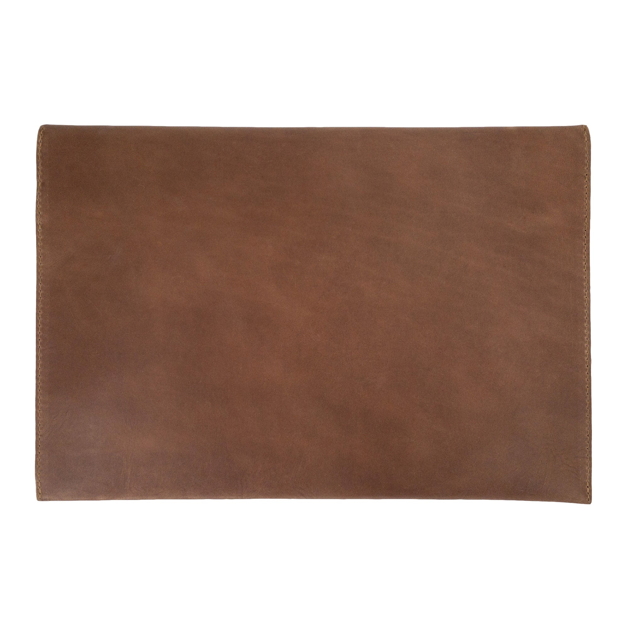 Elegant design of the Hide & Drink MacBook Slim Case showcasing the leather tag, perfect for personalization. This case is compatible with MacBook Air/Pro 13 Inch with M1 Chip, highlighting artisan craftsmanship through its hand cut, hand sewn production.