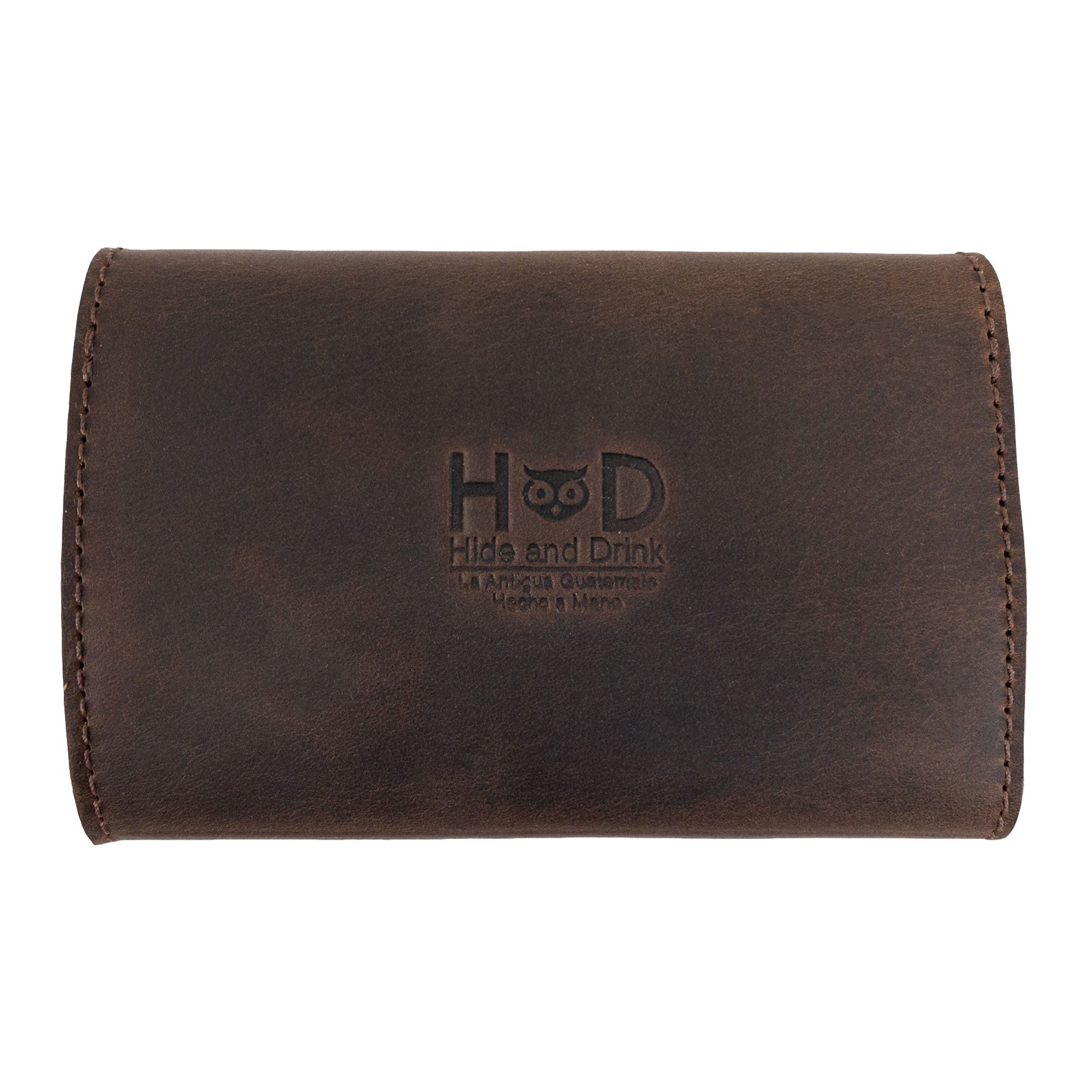 Elegant Nail Clipper Roll Case featuring the Hide and Drink logo by The Stockyard Exchange. Made from Full Grain Leather, this rustic roll is a practical Nail Clipper Set Case and travel accessory. Artisan-crafted in La Antigua Guatemala, showcasing fine hand-cut and hand-sewn details in small batch production.