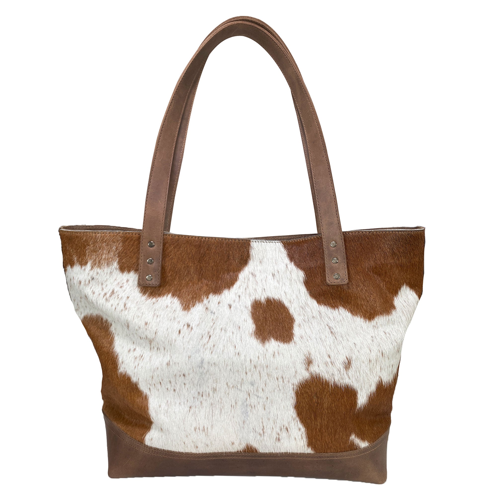 Western Leather Works Formal Tote Bag crafted from Hair on Hide Full Grain Leather, showcasing a unique brown spotted design. This tote combines spaciousness and style, perfect for any occasion. Handmade with care, featuring fire branded detailing and a plaid cotton interior lining. Artisan, handmade in La Antigua Guatemala & Oaxaca Mexico.