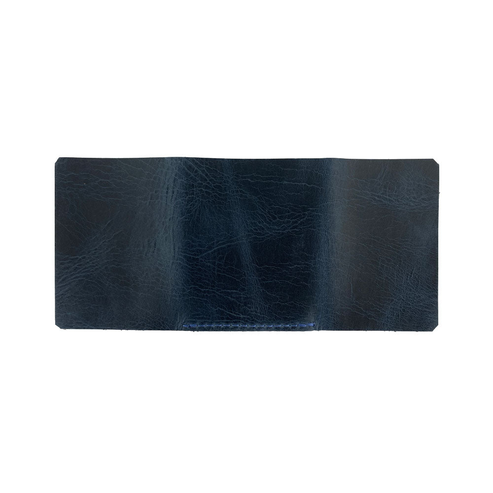 The bottom view of the Hide & Drink Minimalist Wallet Bills Only, emphasizing its fine craft in Full Grain Leather. This Ultra Minimalist Wallet acts as a minimalist cash organizer, representing the quality of artisan workmanship from La Antigua Guatemala and Oaxaca Mexico.