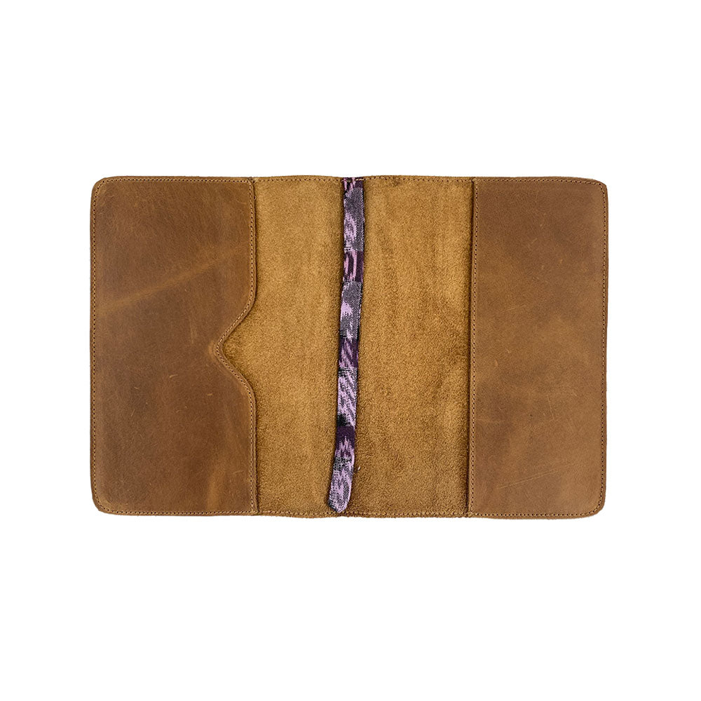Back view of the patchwork leather Full Grain Leather Journal Cover for Moleskine Cahier XL (7.5 x 9.75 in.) by Hide & Drink, showcasing its colorful and unique exterior design, ensuring attention in any setting.