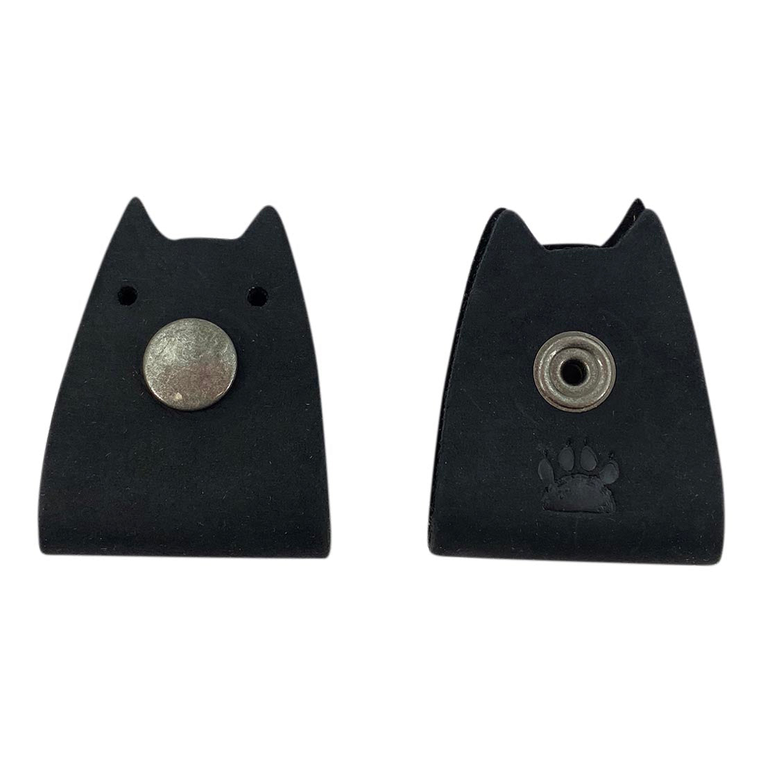 Black Cat Cord Keeper (2 Pack) by Taco Dog with snap button clasp for secure cable management. Made from full grain leather, it's perfect for organizing your earbuds, headphones, and chargers while traveling. Artisan crafted in La Antigua Guatemala & Oaxaca Mexico.