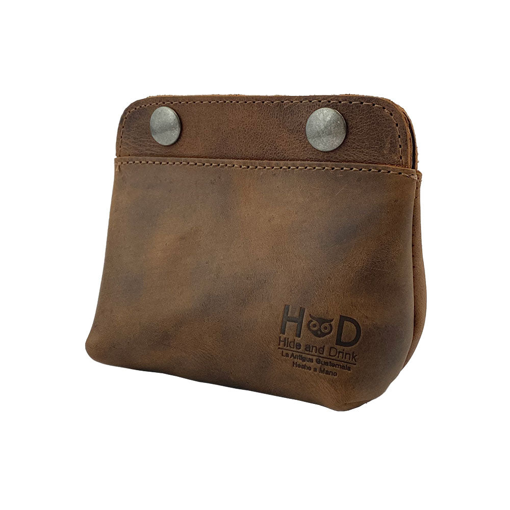 Side angle of the Hide & Drink Double Snap Pouch, showcasing its appeal as a stylish coin purse, cash & card holder, and makeup organizer. This handcrafted full grain leather pouch is a product of artisan craftsmanship from La Antigua Guatemala.