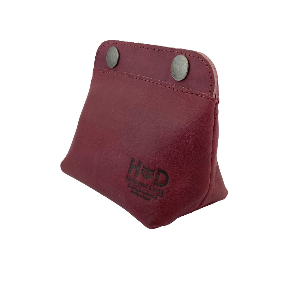 Side view of Hide & Drink Double Snap Pouch in bright green full grain leather, showcasing its use for coins and cash. Handcrafted artisan quality from La Antigua Guatemala.