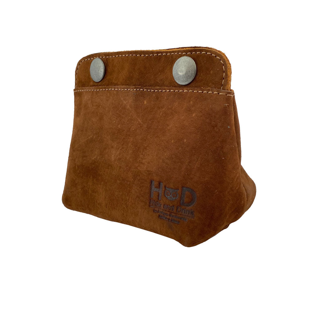 Side view of Hide & Drink Double Snap Pouch made with high-quality brown suede, ideal as a coin purse and cash & card holder. This artisan-crafted full grain leather pouch is designed for small essentials and handmade in La Antigua Guatemala.