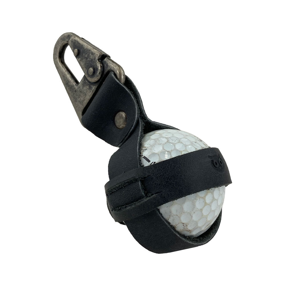 Stylish Golf Ball Holder from Hide & Drink designed to secure a golf ball with a durable belt loop hook, made from rustic full grain leather. This artisan product is handcrafted in small batches in La Antigua Guatemala & Oaxaca Mexico.