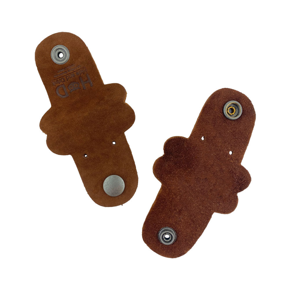 Two brown Dog Shaped Cord Keepers showing the back with snaps, designed by Hide & Drink and created from high-quality Full Grain Leather. Dog Shaped Cord Keeper (Cord Clam) 2-Pack, Full Grain Leather, StockyardX, Small Batch Production, Hand Cut, Hand Sewn, Fire Branded, Artisan, Handmade in La Antigua Guatemala & Oaxaca Mexico.