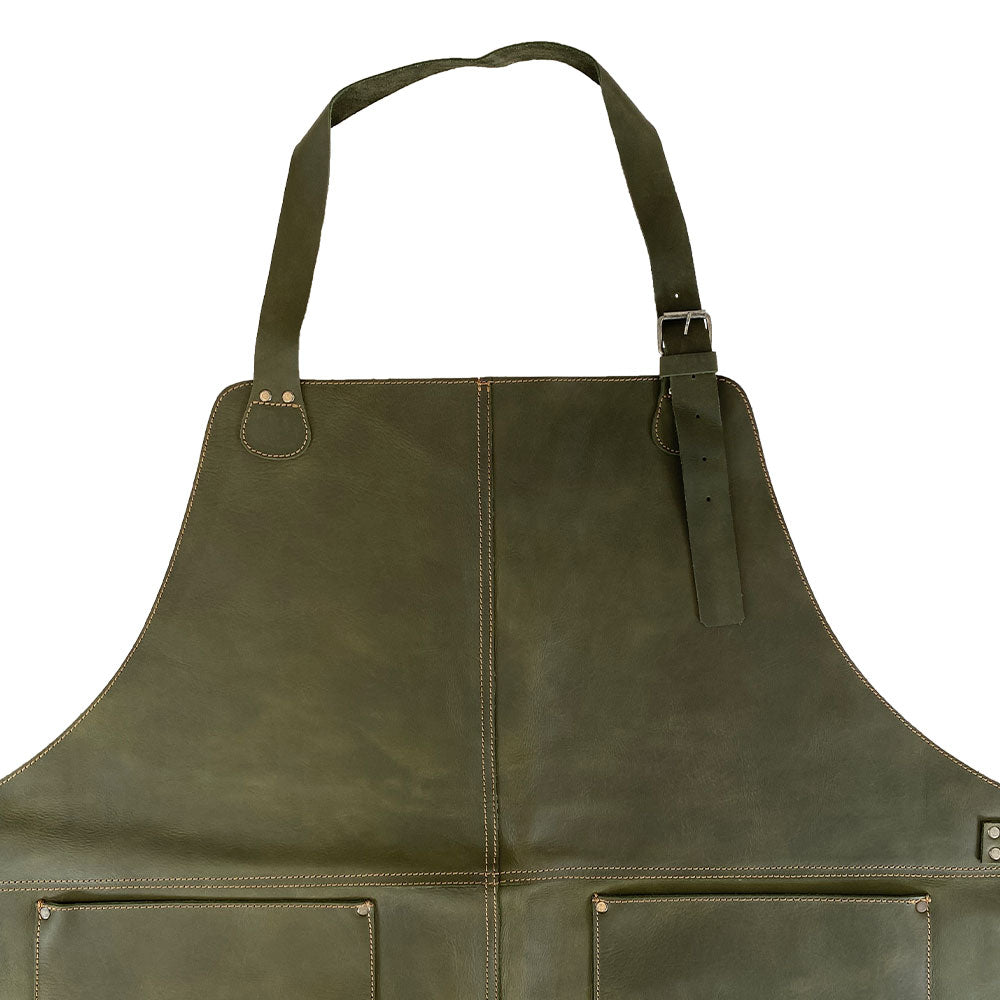 The upper section of the Hide & Drink Leather Apron in green displaying adjustable straps, crafted for comfort and utility. A quality Leather Apron made from premium full grain leather.