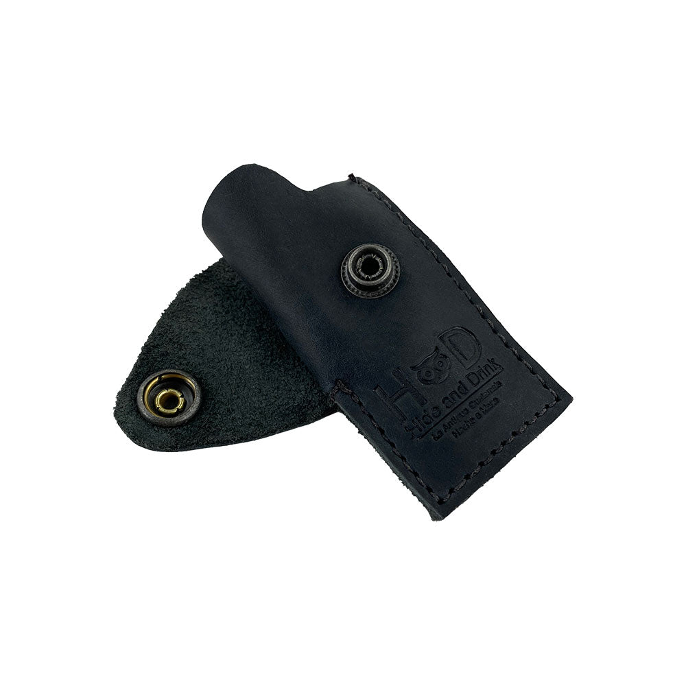 Detailed view of the Hide & Drink Lighter Protective Case, featuring a brass snap closure and showcasing exceptional full grain leather quality. Artisan crafted in La Antigua Guatemala & Oaxaca Mexico. Keywords: Lighter Protective Case, Full Grain Leather, StockyardX.