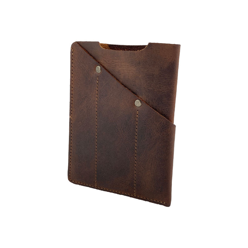 Hide & Drink Multi-Tool Pocket Sleeve presented at an angle, emphasizing its functionality as a Rustic Multitool Pocket Pouch, Classic Multipurpose Bag, and Compact Organizer. Made from durable Full Grain Leather, crafted through small batch production with hand cut, hand sewn techniques in La Antigua Guatemala & Oaxaca Mexico.