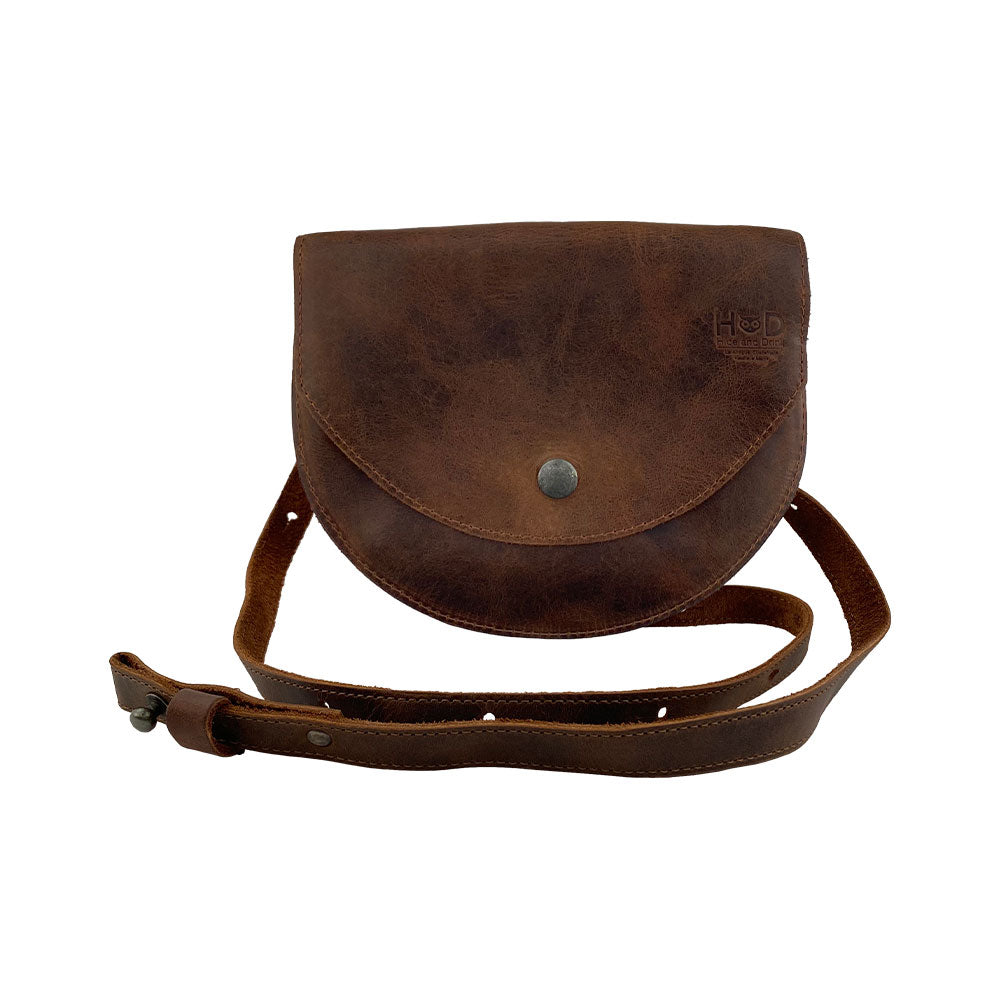 Front view of the Hide & Drink Hip and Shoulder Bag, crafted from high-quality Full Grain Leather. Its artisan craftsmanship highlights the brand's commitment to Small Batch Production, with meticulous hand cut and hand sewn details. Handmade in La Antigua Guatemala & Oaxaca Mexico.