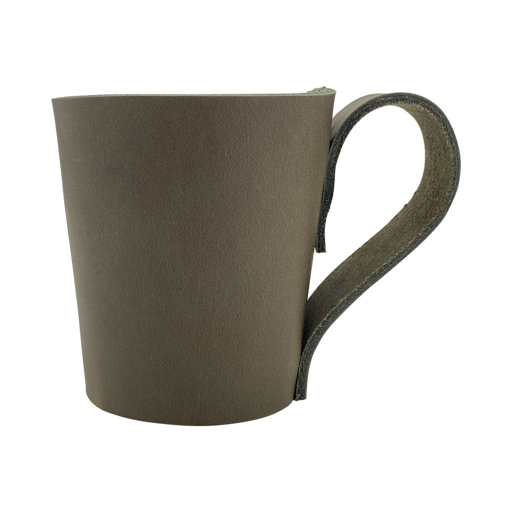 Stylish Pint Sleeve with Handle by Hide & Drink, highlighting its artisan Full Grain Leather composition. Perfect for enhancing your bar or pub vibe, this piece is Hand Cut and Hand Sewn for quality assurance.