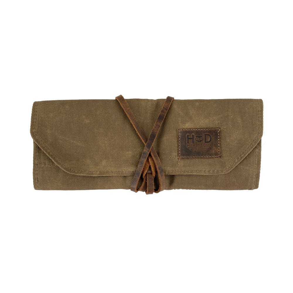 Hide & Drink Tool Roll features a chic small tool roll-up bag with 10 slots, constructed from high-quality full grain leather. Ideal as a portable carry-on pouch for woodworking tools, it enhances your workshop storage solution. Handcrafted in La Antigua Guatemala & Oaxaca Mexico, each item showcases artisan craftsmanship.