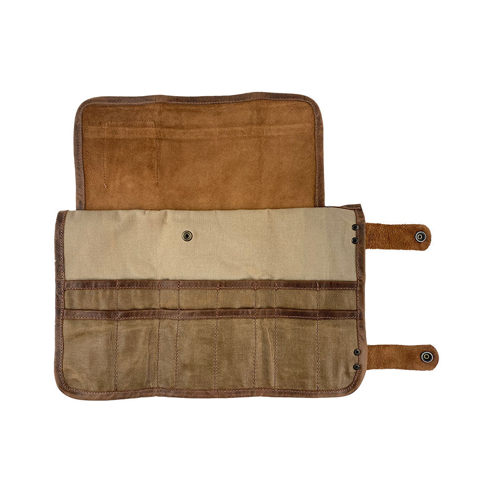 Open layout of Hide & Drink's Barber Tool Roll showcasing a Snap Tool Roll Up Bag with 14 Slots for scissors & screwdrivers. Crafted from durable Full Grain Leather, this portable carry case reflects StockyardX's commitment to small batch production and artisan craftsmanship, hand cut, hand sewn, and fire branded in La Antigua Guatemala & Oaxaca Mexico.