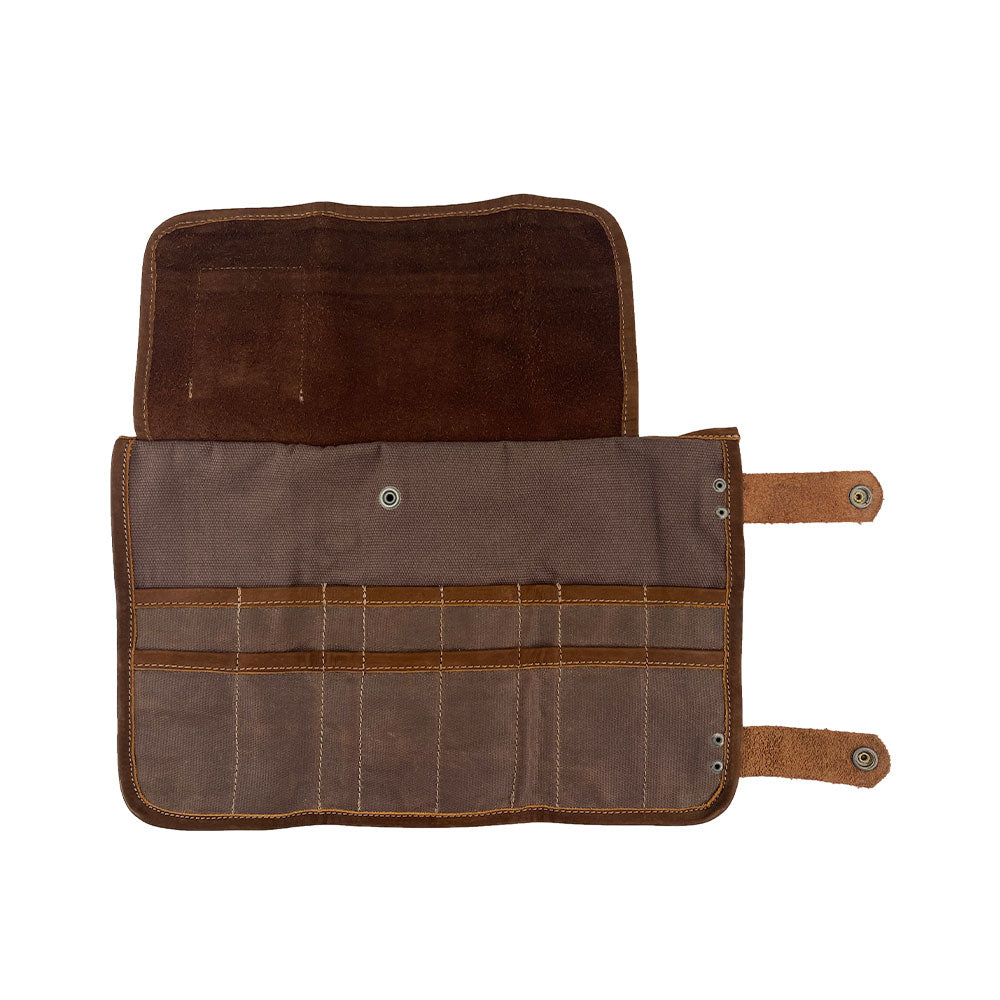 Open layout of Hide & Drink's Barber Tool Roll, showcasing a Snap Tool Roll Up Bag with 14 Slots for efficient storage of scissors & screwdrivers. Crafted from durable Full Grain Leather, this portable carry case reflects StockyardX's commitment to small batch production and artisan craftsmanship, hand cut, hand sewn, and fire branded in La Antigua Guatemala & Oaxaca Mexico.