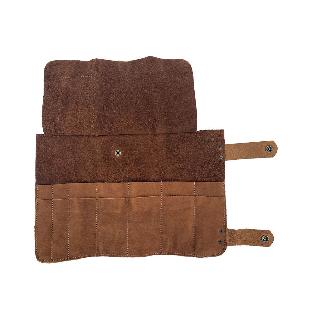 Open layout of Hide & Drink's Barber Tool Roll, featuring a Snap Tool Roll Up Bag with 14 Slots. This portable carry case is designed for your scissors & screwdrivers, made from durable Full Grain Leather. Crafted with care by StockyardX, it reflects small batch production, hand cut, hand sewn, and fire branded in La Antigua Guatemala & Oaxaca Mexico.